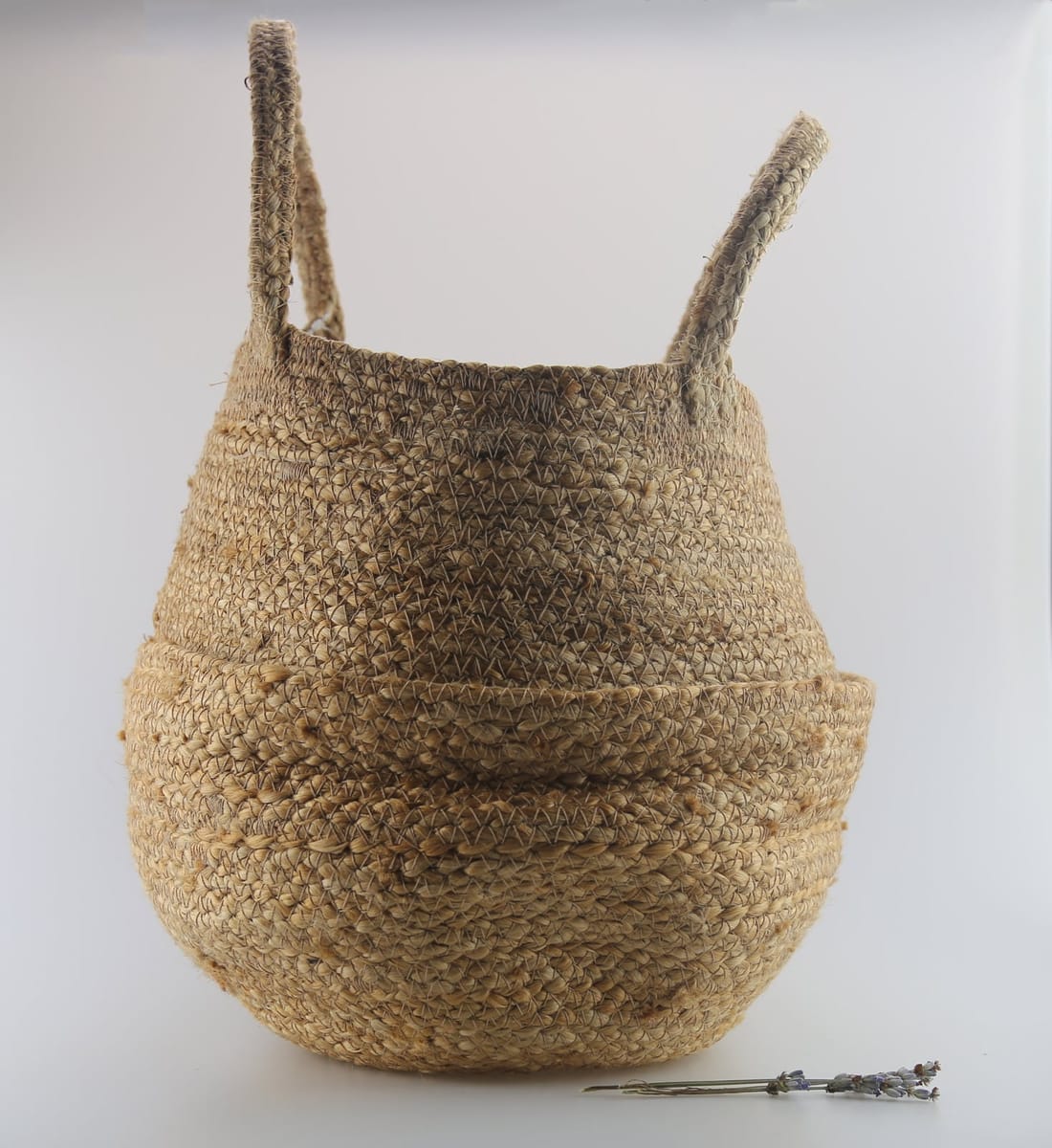 Plaited jute basket with handles